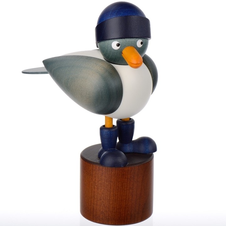 Jolie mouette en bois avec un bonnet bleu