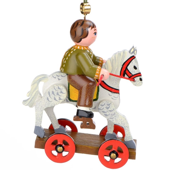 Noël d'antan, enfant sur un cheval de bois, 