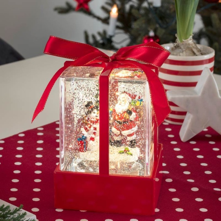 Lanterne à neige "Cadeau de Noël" avec Père Noël & bonhomme de neige