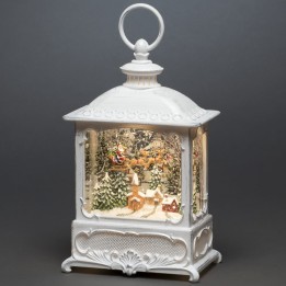 Lanterne de Noël blanche, père Noël volant au-dessus d'un village