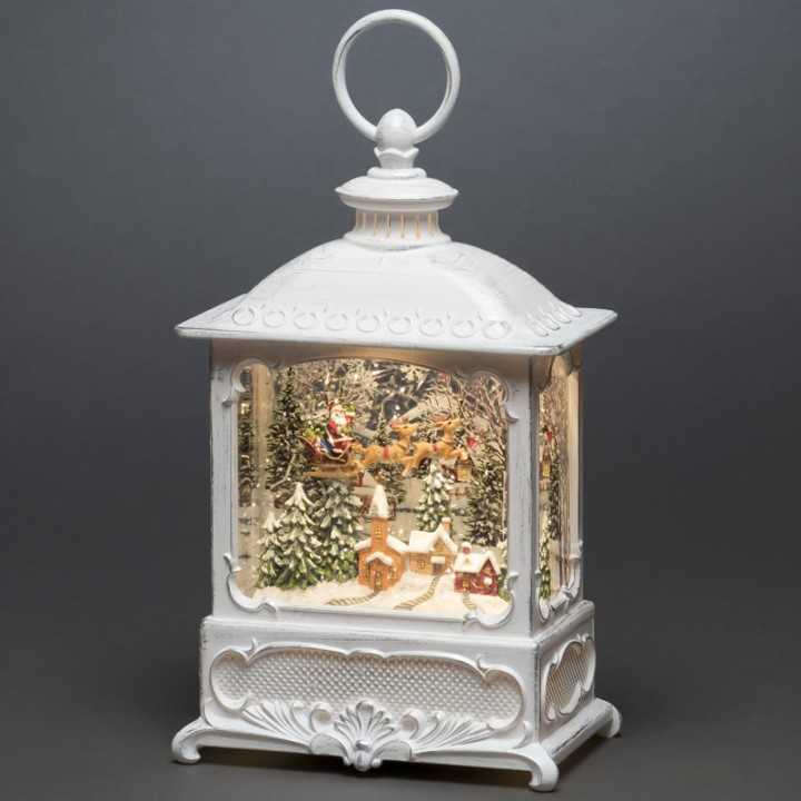 Lanterne de Noël blanche, père Noël volant au-dessus d'un village