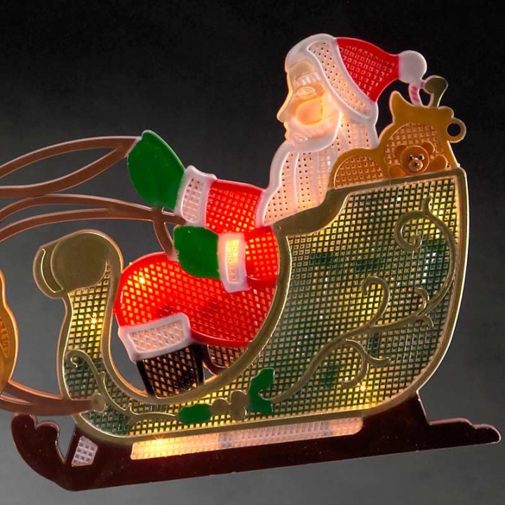 Père Noël lumineux avec traineau et rennes 