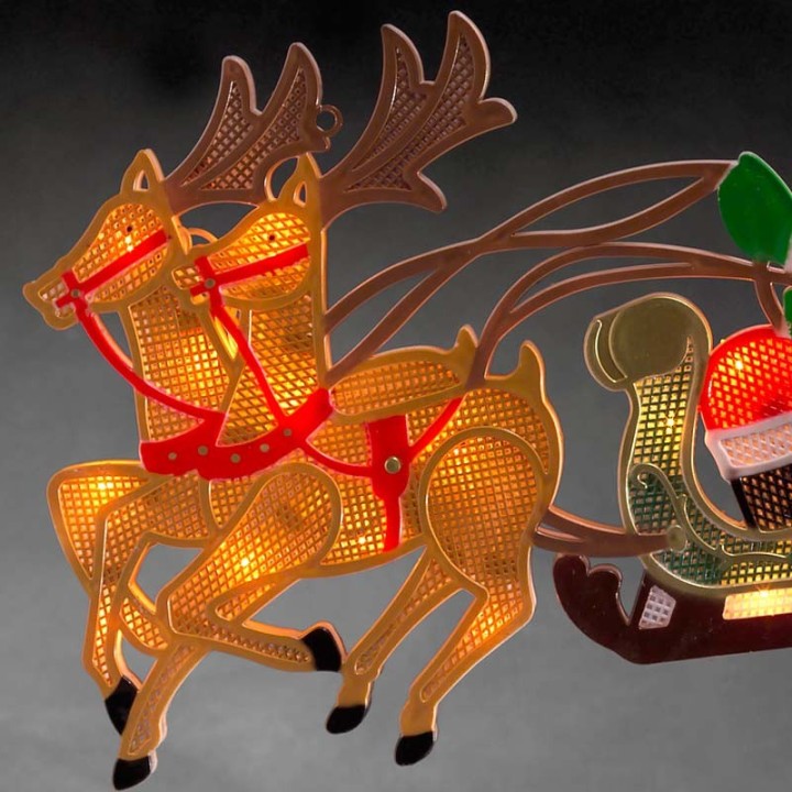 Père Noël lumineux avec traineau et rennes 