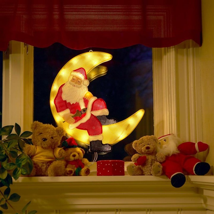 Père Noël lumineux sur la lune