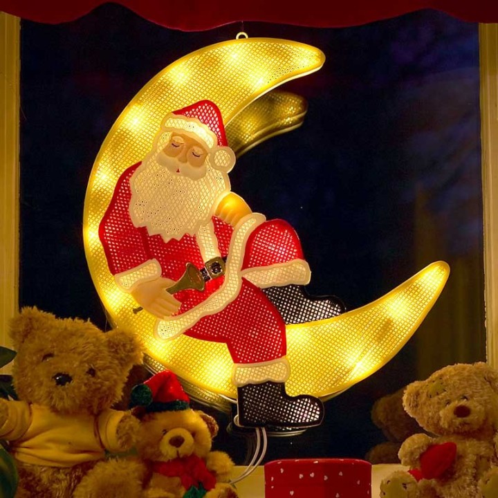 Père Noël lumineux sur la lune