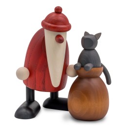 Père Noël en bois avec sac de cadeaux surmonté d’un chat gris