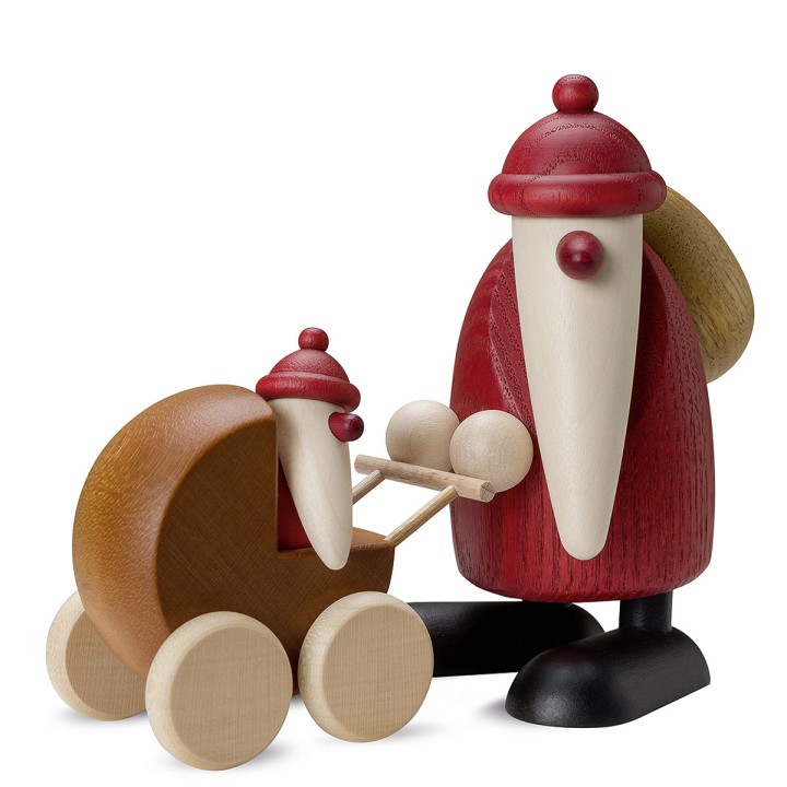 Père Noël en bois poussant un landau avec un petit bébé