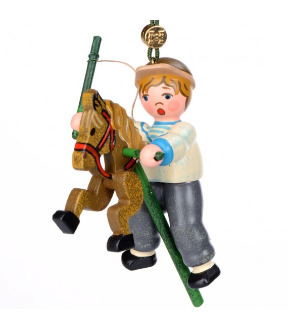 Noël d'autrefois, petit garcon sur un cheval en bois