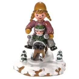 Village de Noël miniature, fillettes sur la luge